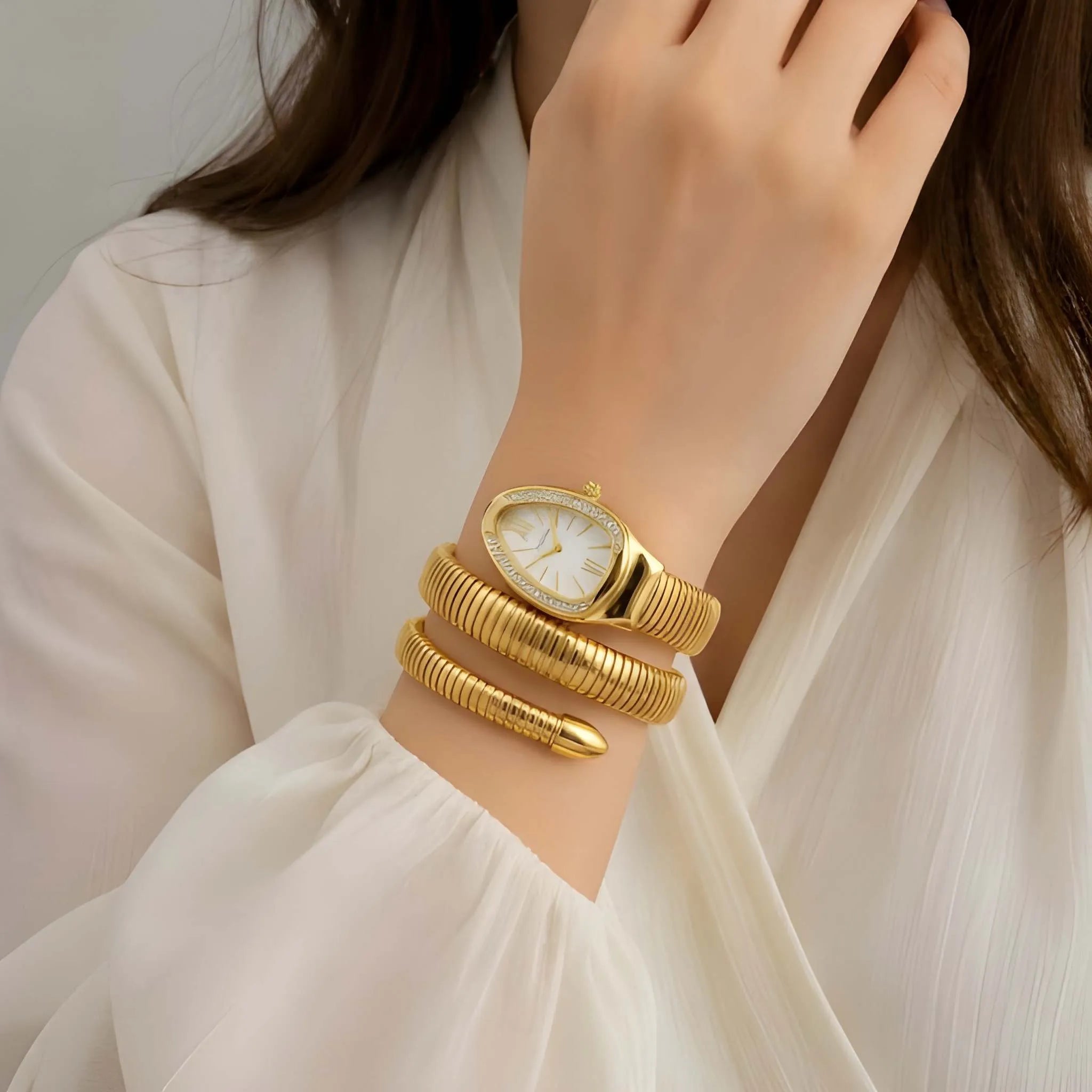 Serpentine Gold Watch